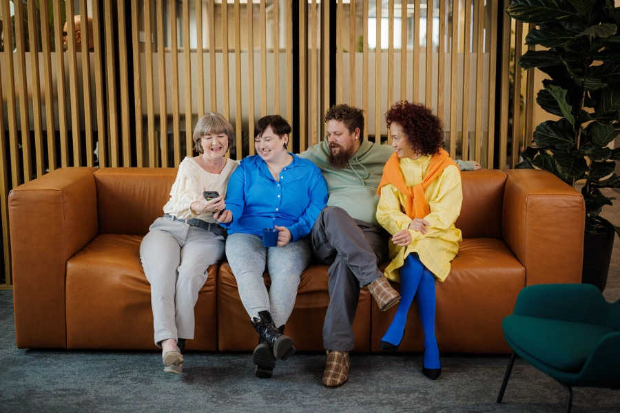 Four persons sitting on the sofa