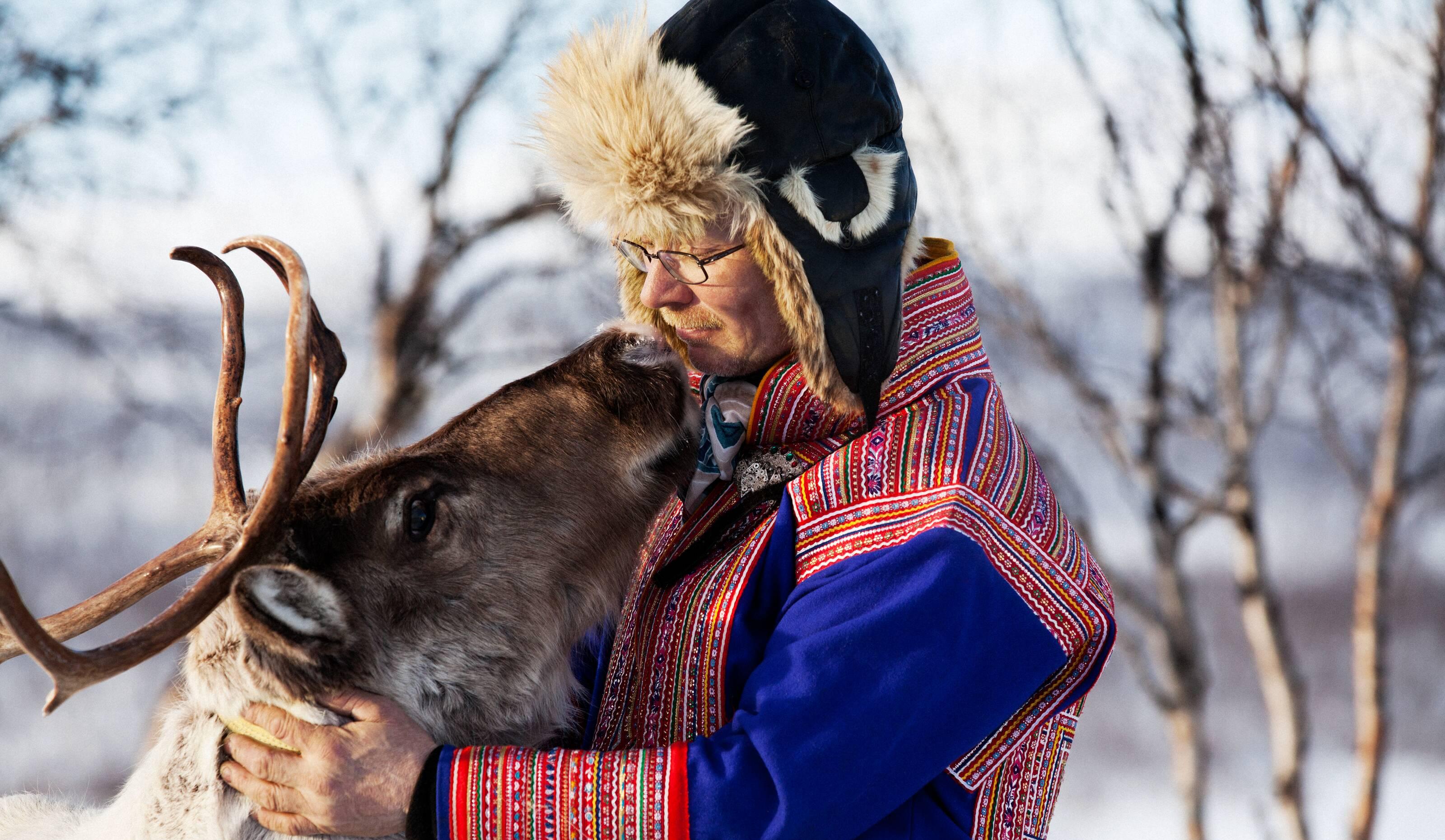 the Sámi man and his reindeer